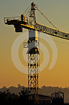 Big construction crane on resiodential construction site in crowded city area