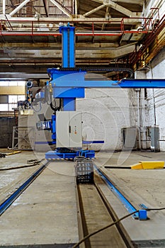 Big construction of metal factory room. Interior of industry warehouse.