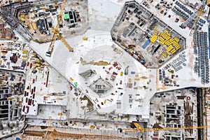 Big construction site with working construction cranes. top view