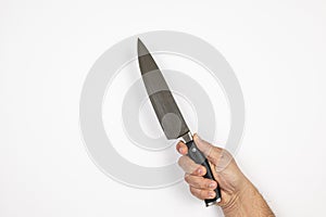 Big Cooking Knife in the hand isolated above white background