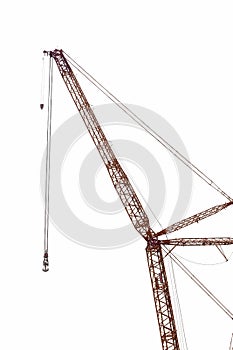Big crane of heavy machinery factory isolated on white.
