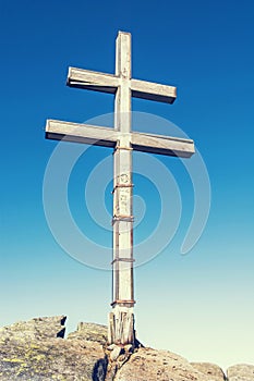 Big cross on the hill Dumbier in Low Tatras mountains, retro photo filter