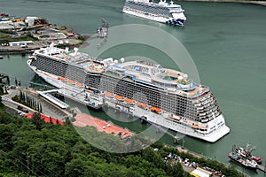 Big cruise ships at the harbour of Juneau , the capital of Alaska