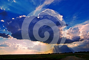 Big cumuli cloud with sun rays