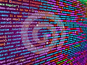 Big data concepts working in cyberspace environment. Modern web development background. Abstract program code on computer screen.