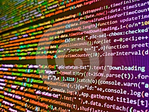 Big data database app. Computer code on laptop