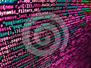 Big data and Internet of things trend. Programming Javascript on laptop computer screen. Hi-tech modern screen of data, digits and