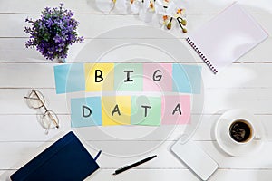 BIG DATA. Message at colorful note papers on a desk background.