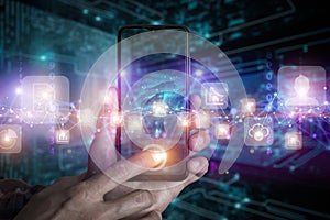 Big data technology background. Using smartphone against the background of visualization of a computer internet network