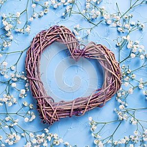 Big decorative heart and pattern from fresh white gypsofila flowers photo