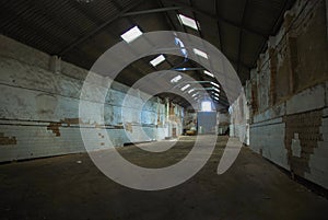 Big deserted factory - empty warehouse. photo