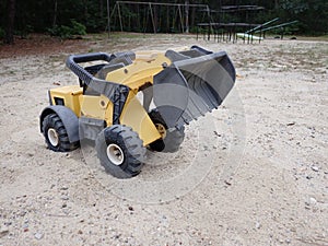 big digger construction vehicle.. toy on playground for pretend play