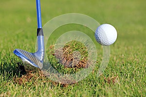Big Divot While Chipping A Golf Ball photo