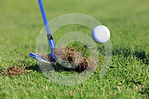 Big Divot While Chipping A Golf Ball photo