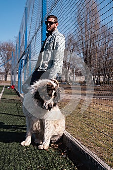 Big dog. the fur is fluffy at pooch, the Central Asian Shepherd Dog is white. Alabai or kagal