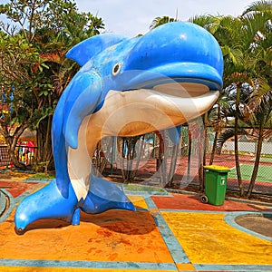 The big dolphin statue in the house swimming pool