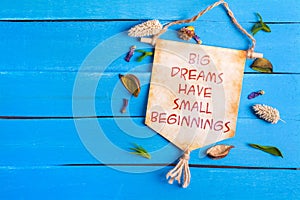 Big dreams have small beginnings text on Paper Scroll