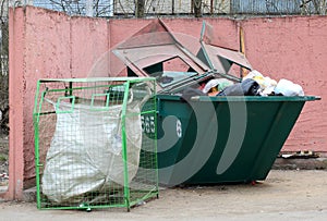 Big dumpster full of garbage,mesh container for separate waste collection