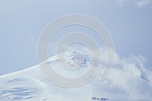 Big Elbrus mountain in summe on cloudy day