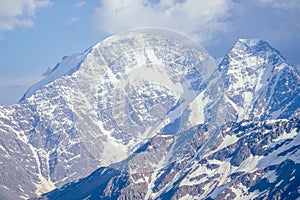 Big Elbrus mountain in summe on cloudy day