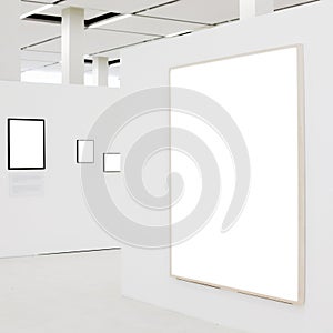 Big empty frame on white wall exhibition