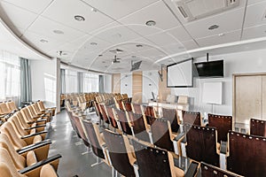 Big empty modern conference hall in luxury hotel. Audience for Speakers at Business convention and Presentation. Photo