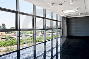 Big empty office space with window wall. Day light illumination.