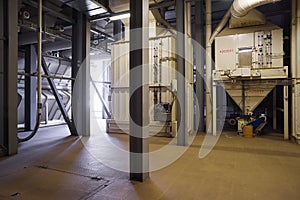 Big empty workshop for processing grain in modern factory. Industrial interior