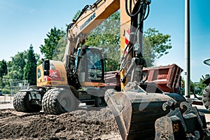Big excavator, work on the road