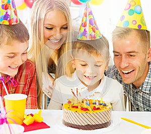 Big family celebrating birthday of little boy