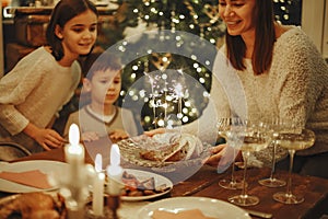 Big family with children celebrate New Year at cozy warm homely atmosphere