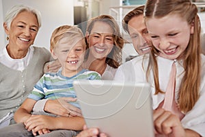 Big family, children and tablet for elearning, online education and learning website on home sofa with parents and