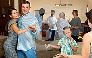 Big family dancing in living room