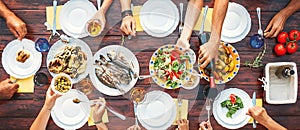 Big family dinner. Top vertical view on the table with dishes an