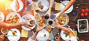 Big family dinner. Vertical top view on served table and hands w photo