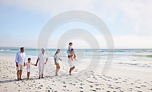 Big family, grandparents walking or children on beach with young siblings holding hands on holiday together. Dad, mom or