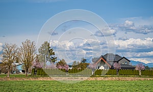 Big family house built on farm land. Image of residential house. Typical North American Country Farm House