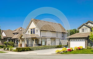 Big family house with concrete driveway to the garage