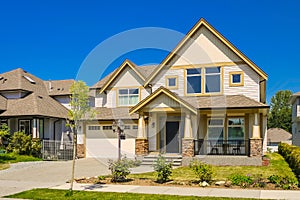 Big family house with concrete driveway to the garage