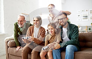 Big family playing video games together, enjoying weekend together