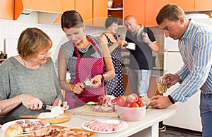 Big family preparing dinner