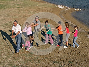 Big family on sandy beach