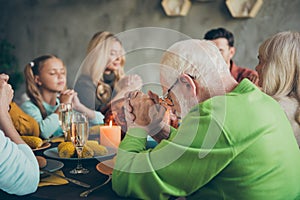 Big family small little kids mature retired people meeting on thanksgiving day sit table with large banquet meal roasted