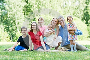 Big family in summer park outdoors.