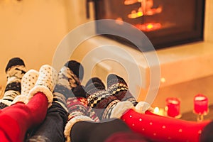 Big family is warming near the fireplace