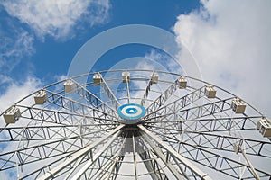 Big ferries wheel on sky background.