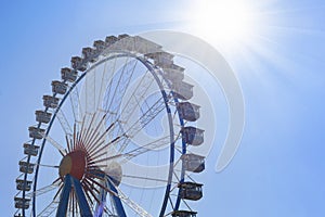 Big ferris wheel over blue sky