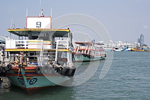 Big Ferry Boats stop at pier in the sea