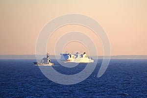 Big ferry and tender on fairway in the Baltic Sea