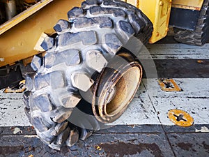 big flat tyre of old used buldozer